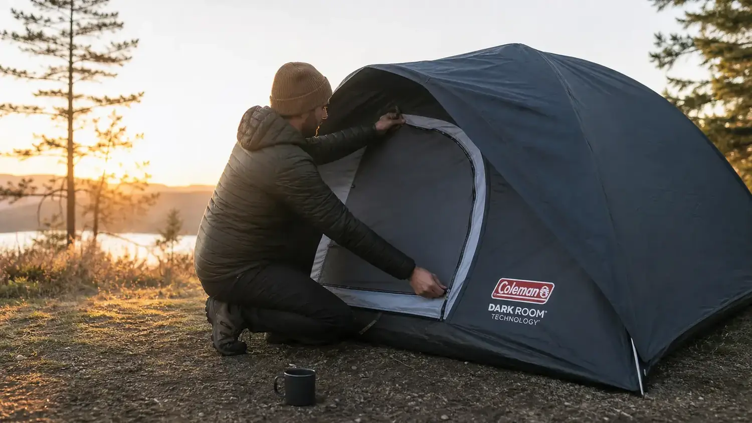 Close-up of a hand zipping the Coleman Sundome tent door with the dark room fly visible overhead
